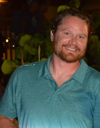 Evan smiling in a professional portrait