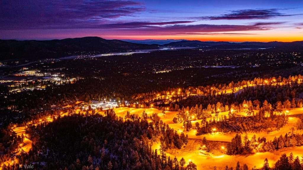 Night view of Big Bear illuminated slopes and mountain landscape