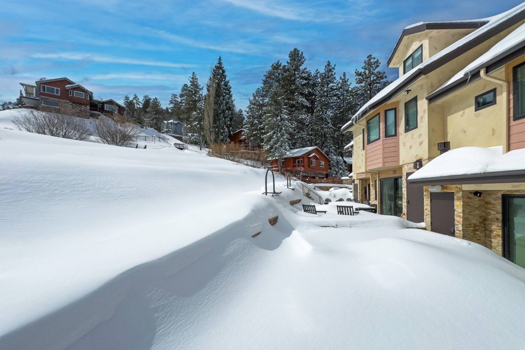 Residential condos near Bear Mountain ski resort covered in snow