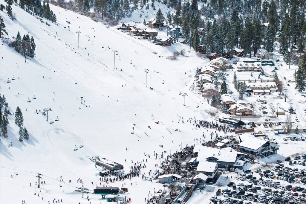 Busy ski day at Bear Mountain with lift lines and Comstock Highlands nearby