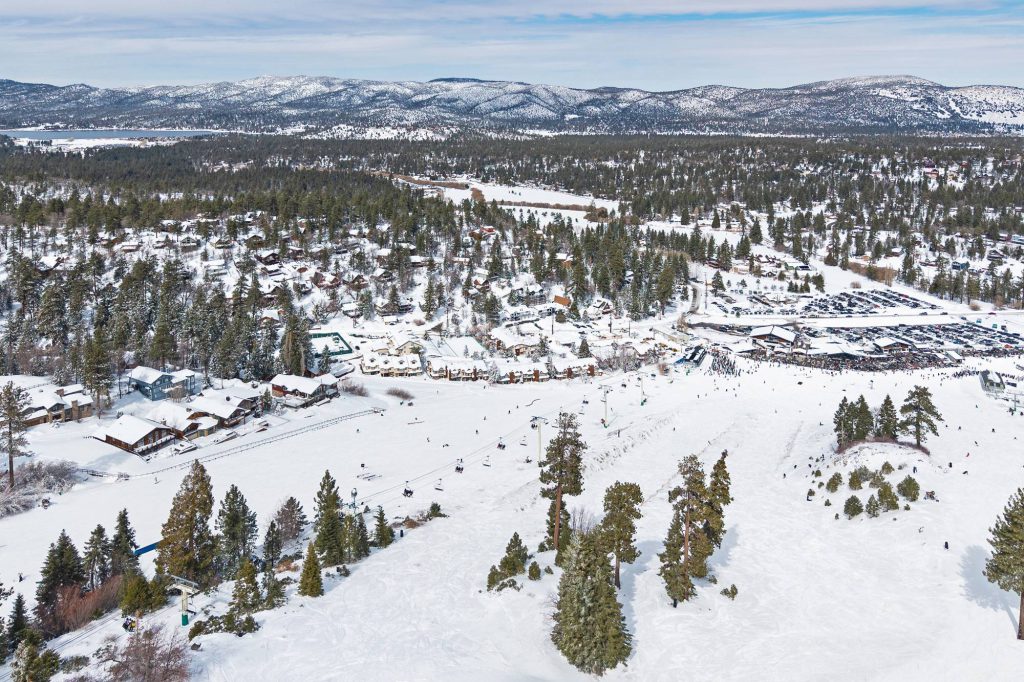 Drone view of Comstock Highlands condos beside Bear Mountain chairlift