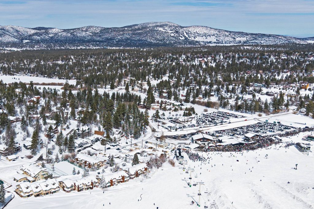 Aerial overview of Bear Mountain ski slopes and surrounding Big Bear neighborhood