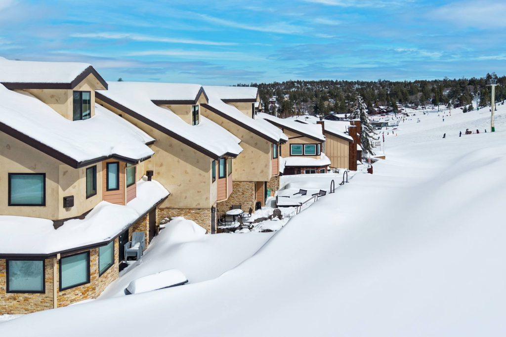 Slope-side view of Comstock Highlands condos at Bear Mountain in winter
