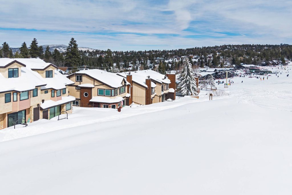Snow-covered Comstock Highlands townhomes overlooking Bear Mountain