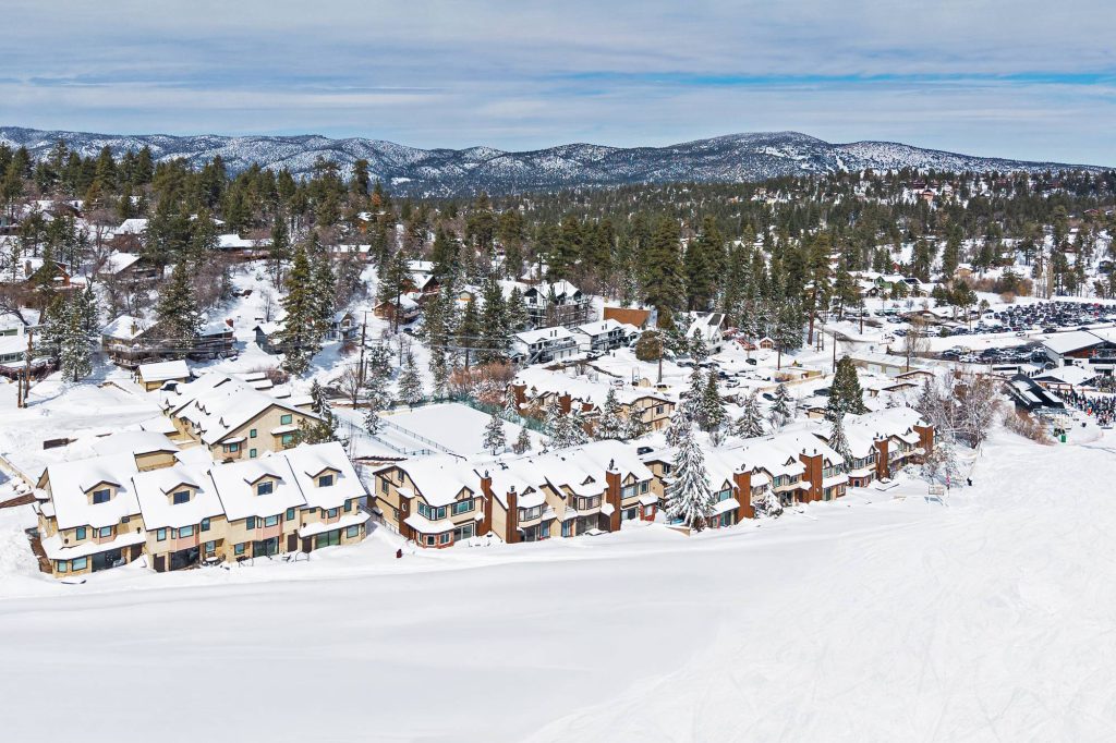 Skiers riding chairlift at Bear Mountain near Comstock Highlands